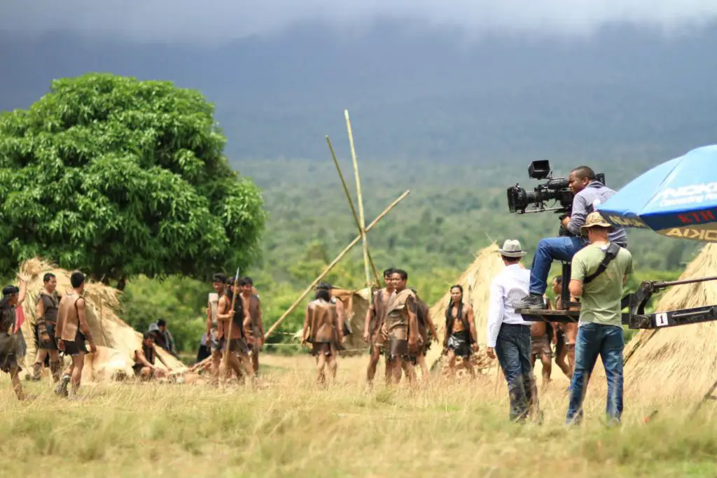 Cinema camera crew in field